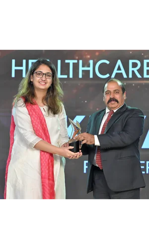 Heroes of Change Award trophy presented to Khyati Gupta by Republic TV Network