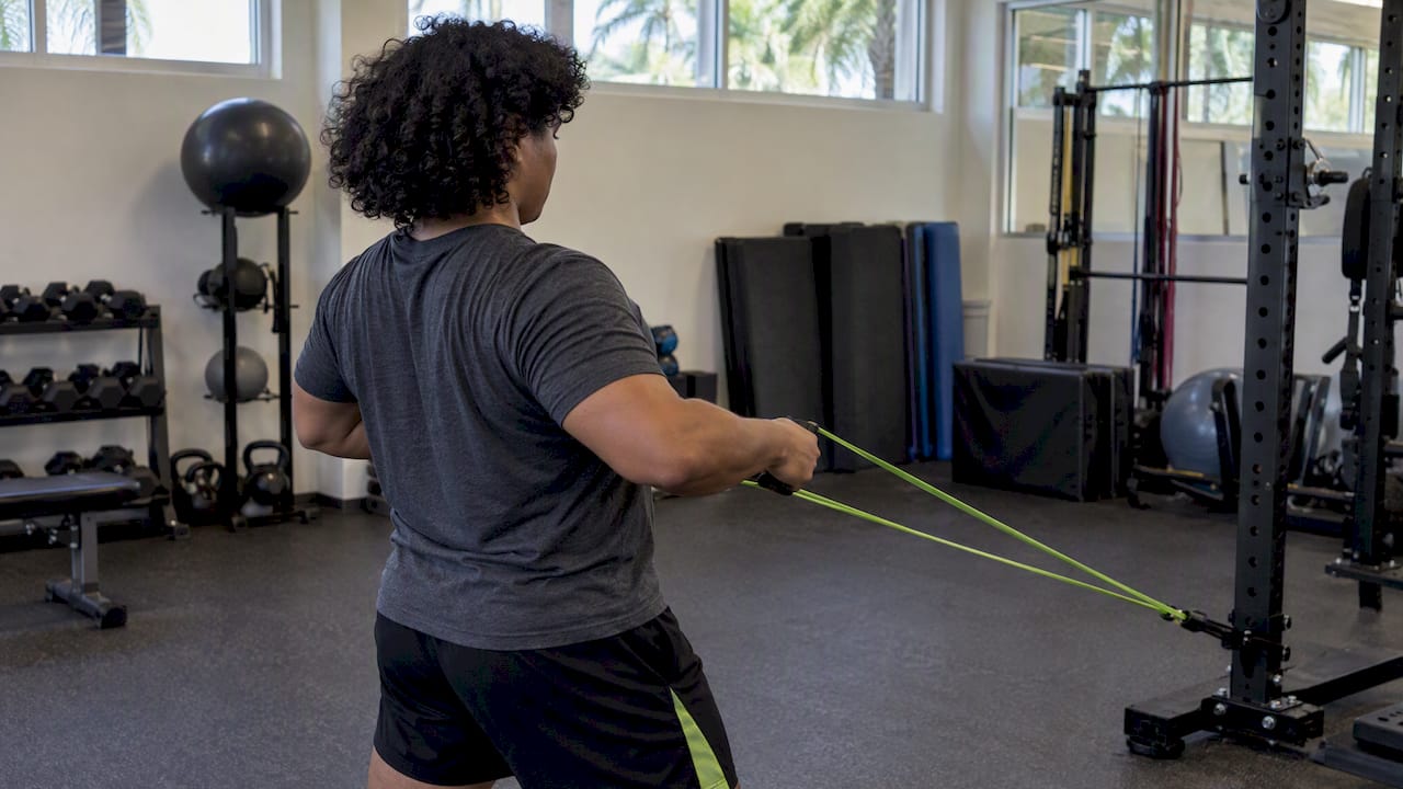 Beginner performing a resistance-band row