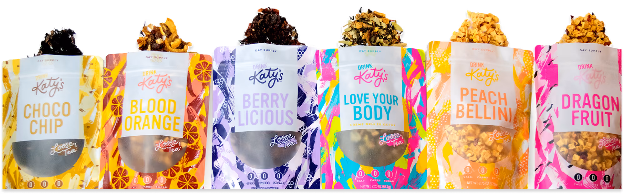 A lineup of Katy's tea bag packaging with tea coming out of the bags