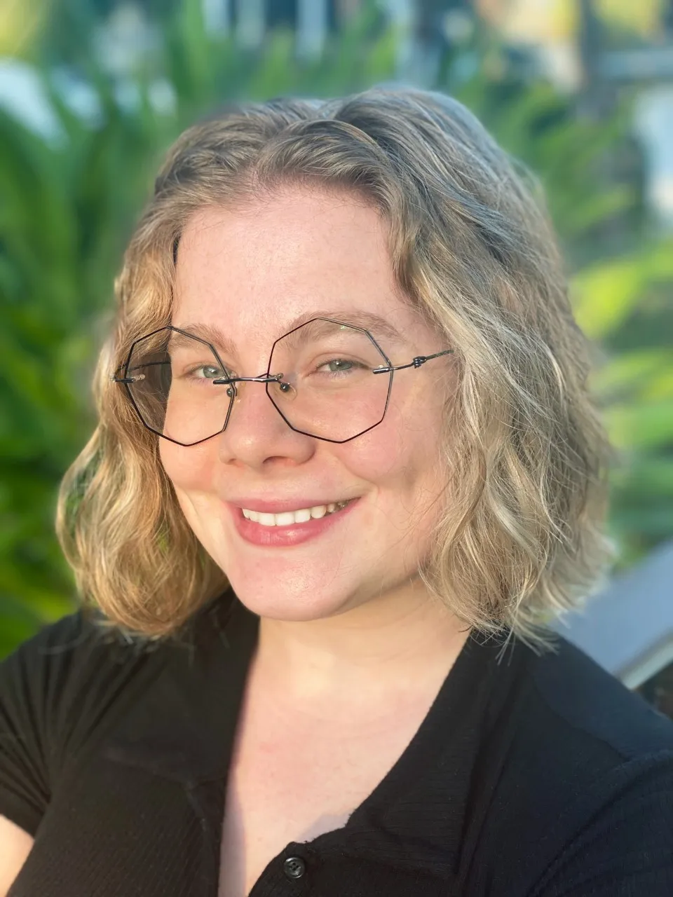 Former PY intern MK Brittain smiles on during golden hour