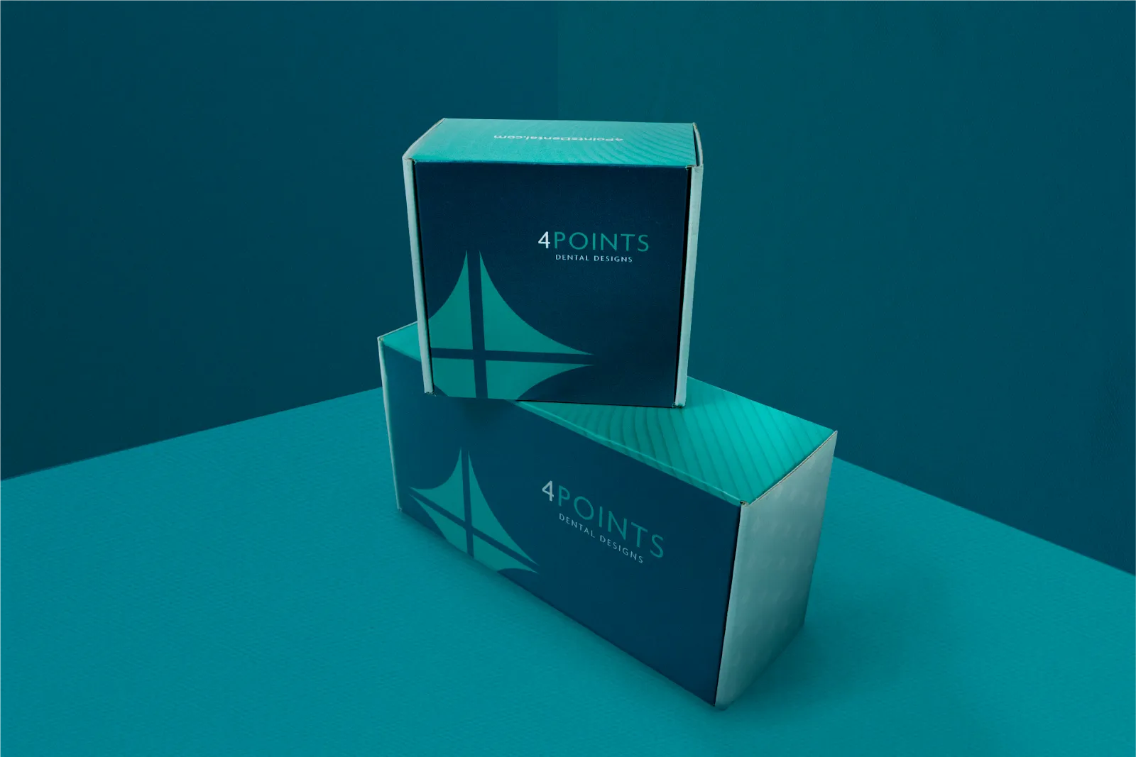 Two boxes for 4Points Dental on a teal background