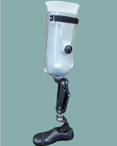 Silver below-knee prosthetic leg with black mechanical knee joint and foot against a plain background.