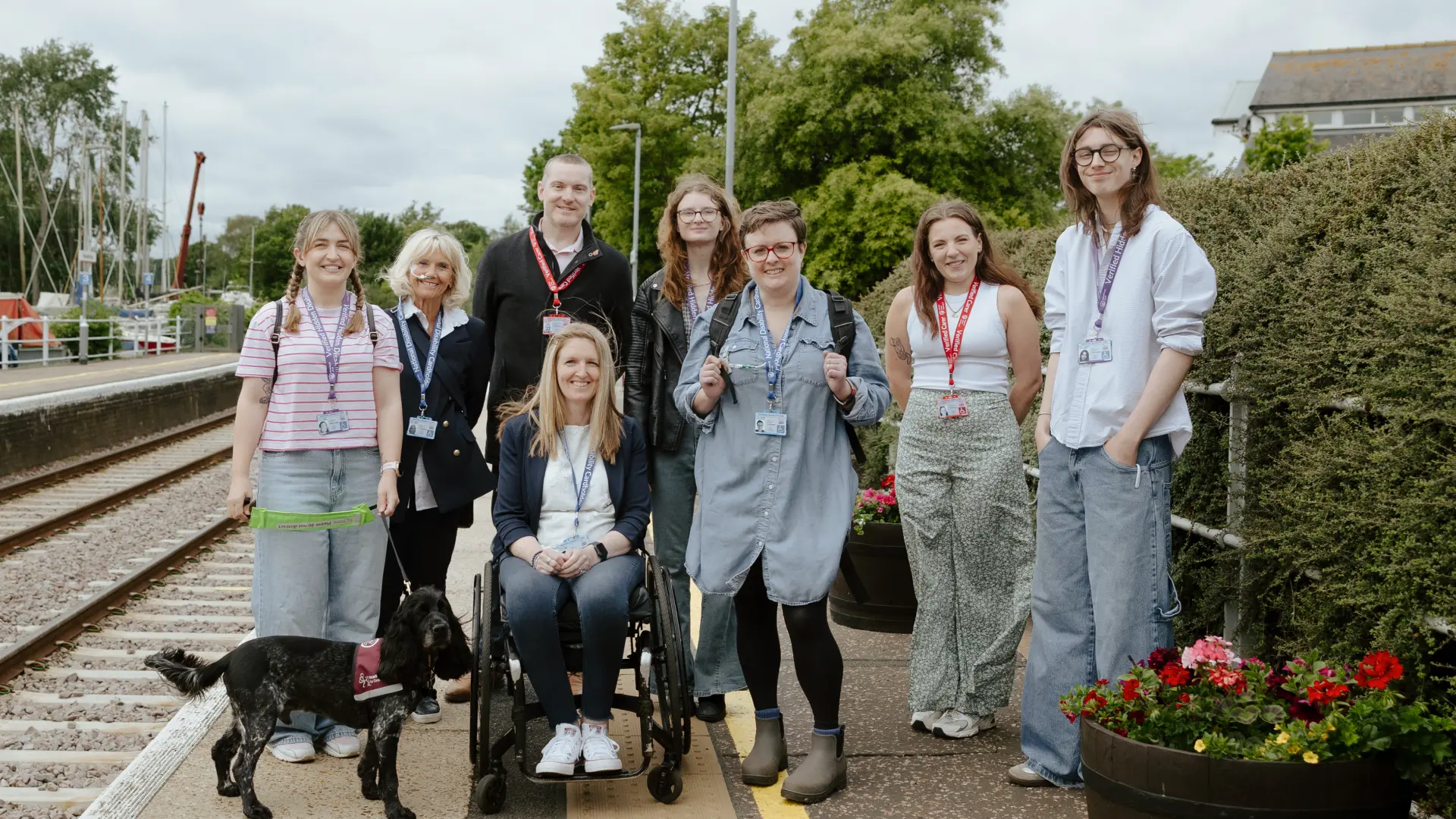 national disability card holder showing her card at a venue for carer ticket access