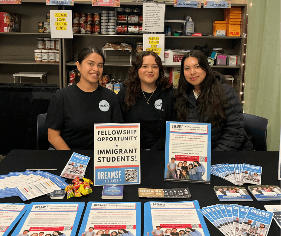 DreamSF fellows staffing a community outreach table with fellowship information and resources.