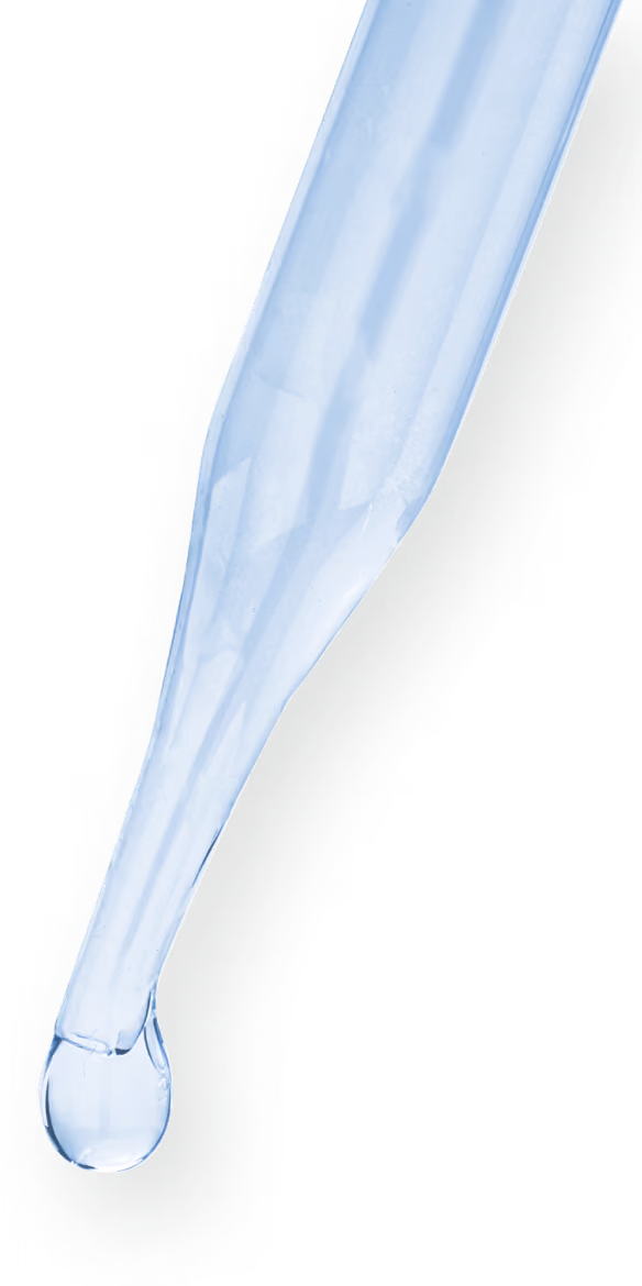 A pipette tip with a single drop of liquid at the tip