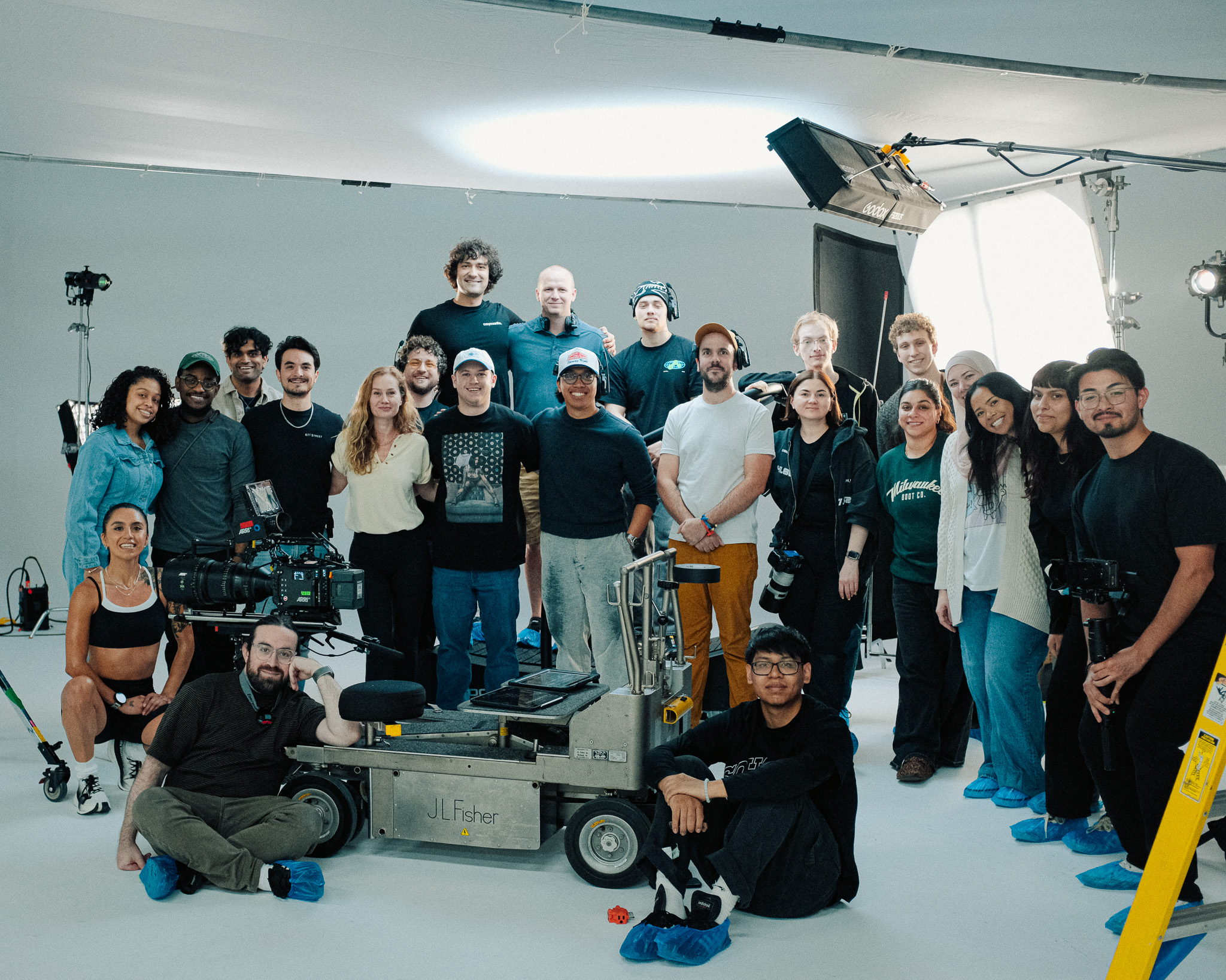 Full cast and crew of Slow Down To Speed Up gathered around the dolly at XVP Studios