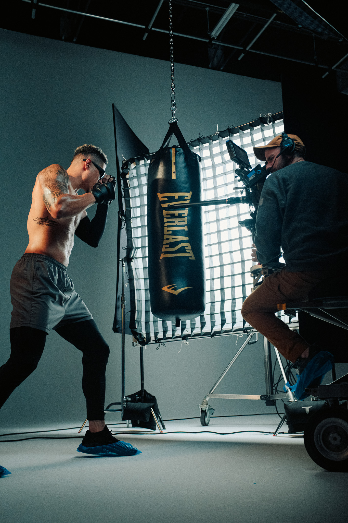 Jordan squaring up to the heavy bag while Joe Sailer shoots with a probe lens