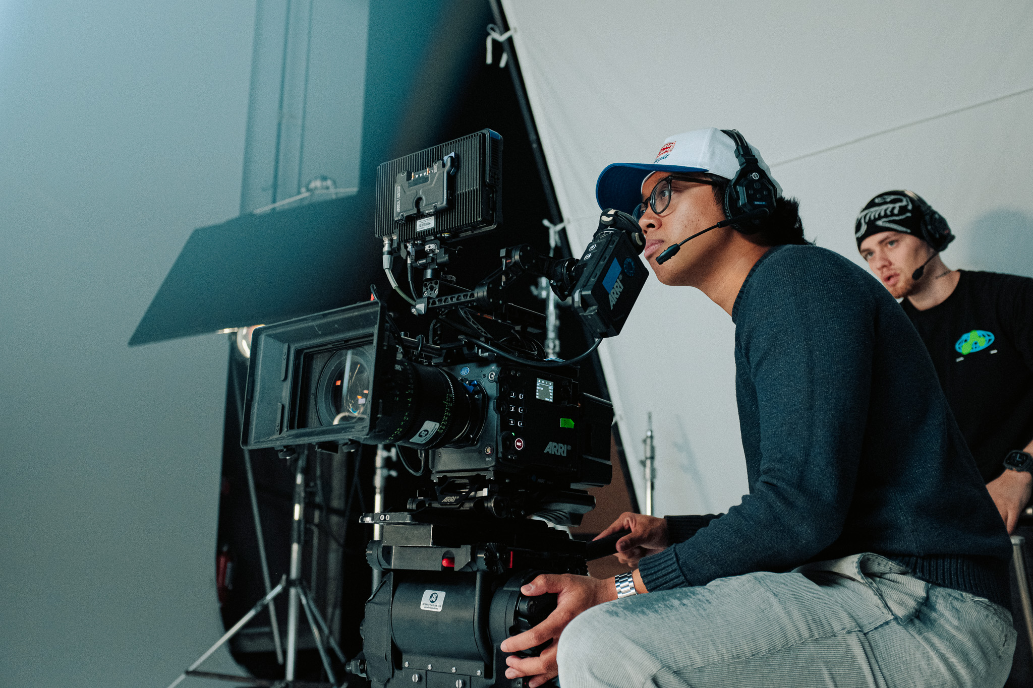 Camera operator looking into the eyepiece of an ARRI Alexa 35 on set