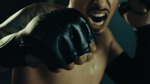The hero shot: Jordan's gloved punch toward the bag in extreme slow motion