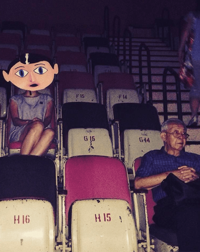 An old photo of The Projector with an old man and an animated face placed on a girl's face