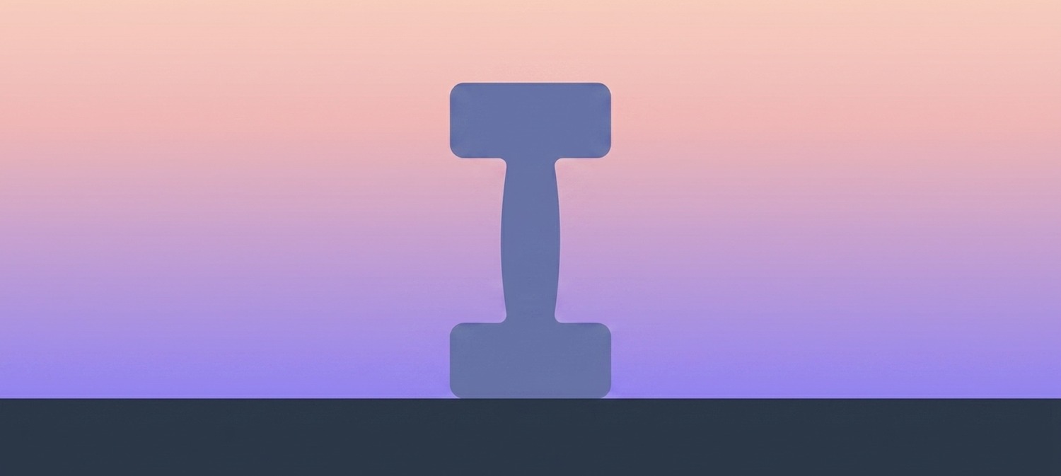 A dumbbell resting on a tabletop