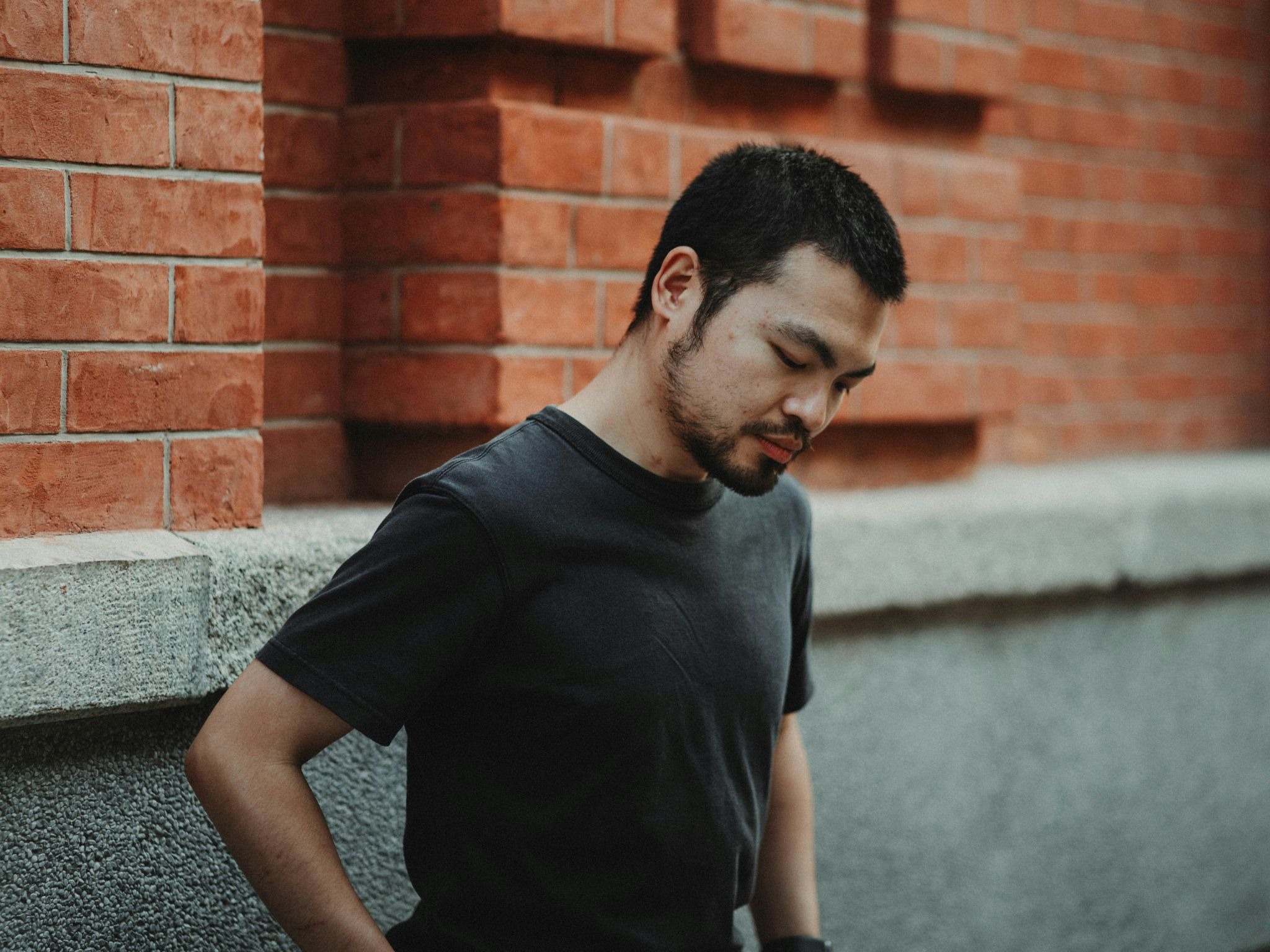 Person coping with chronic pain, stress, and emotional burden often associated with perfectionistic personality traits.