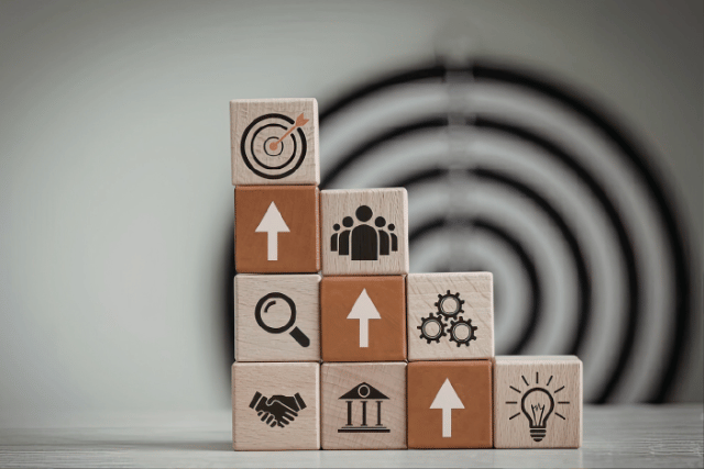Wooden blocks showing hiring talent strategy icons