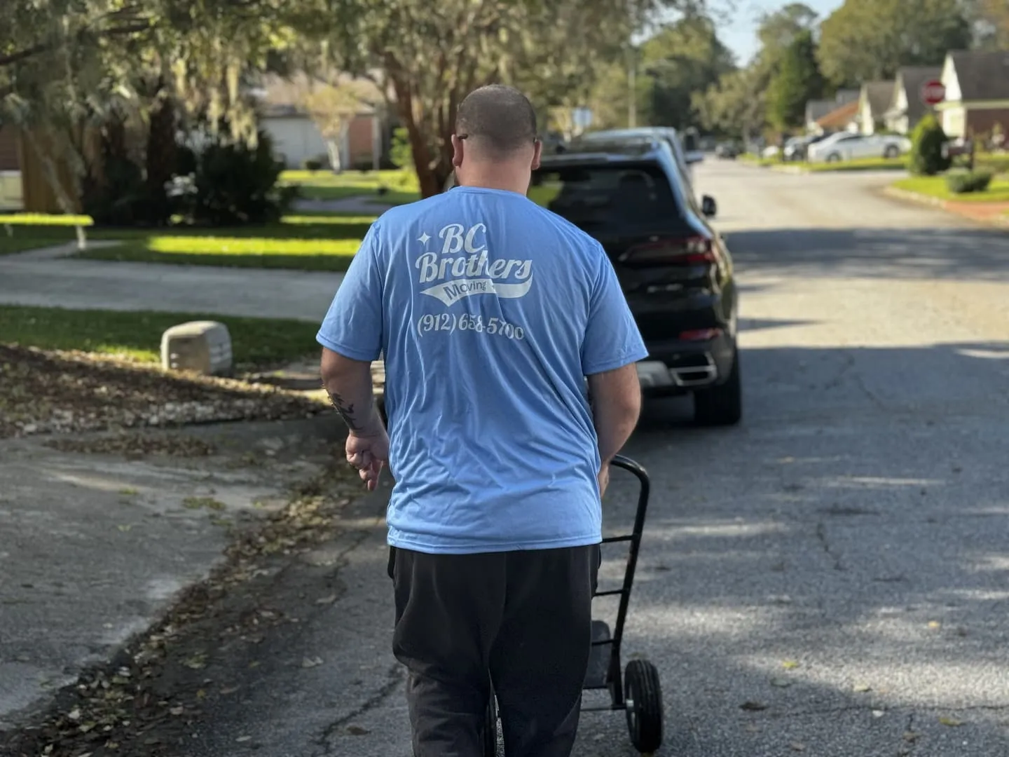 BC Brothers Moving crew member with a loaded moving truck