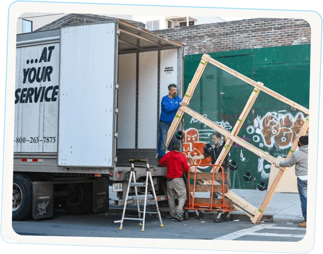 BC Brothers mover unloading furniture during long-distance moving service