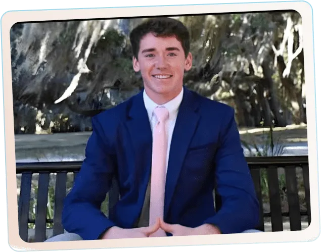 Photo of John Farrell, owner of BC Brothers Moving, smiling in a blue suit outdoors