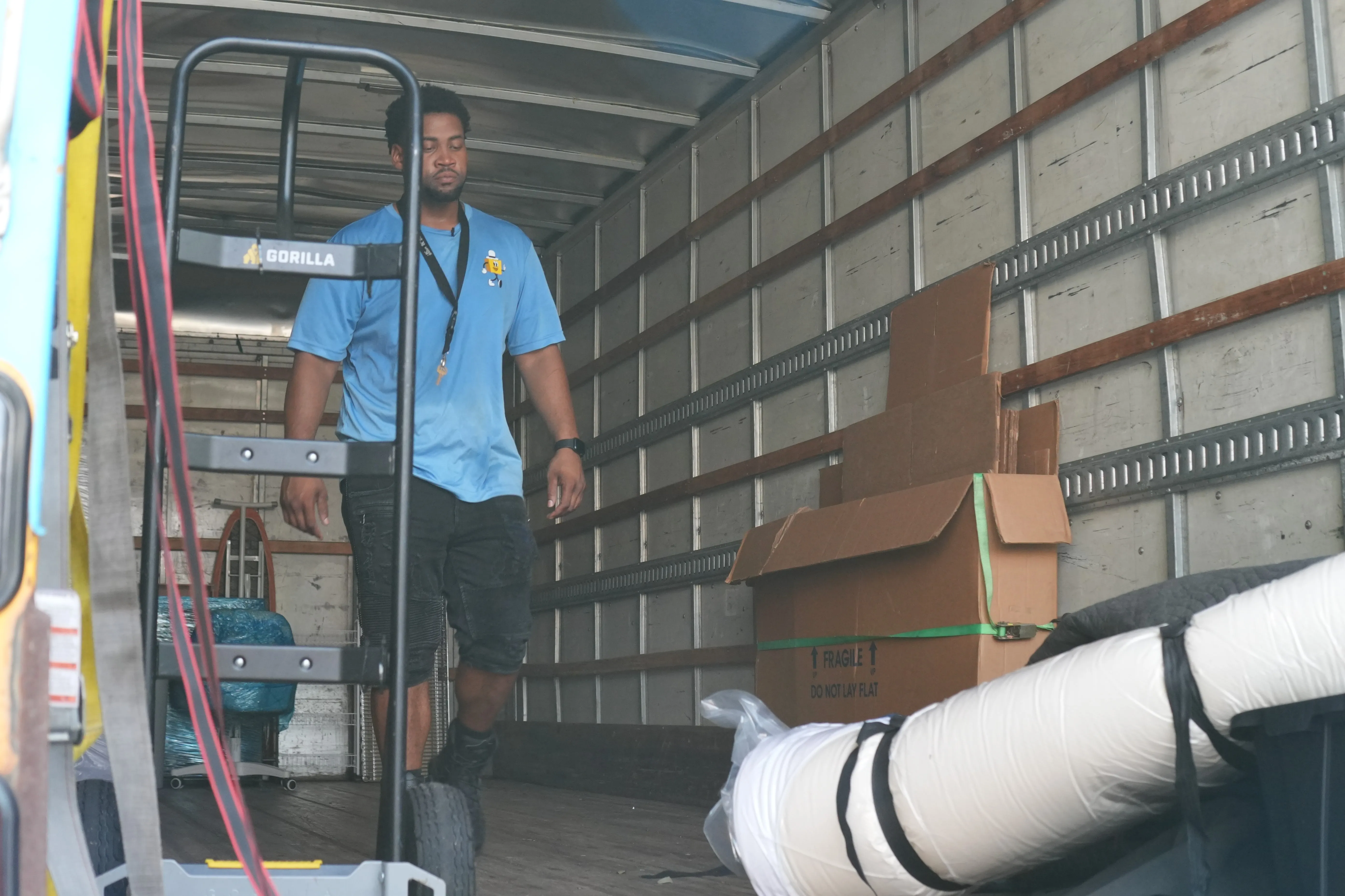 BC Brothers Moving crew handling furniture during a move