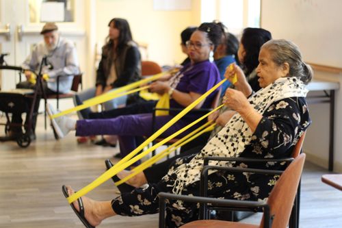 Seated stretching with exercise bands