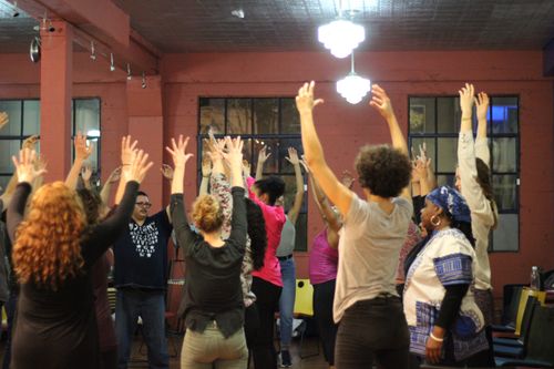 Group raising their hands