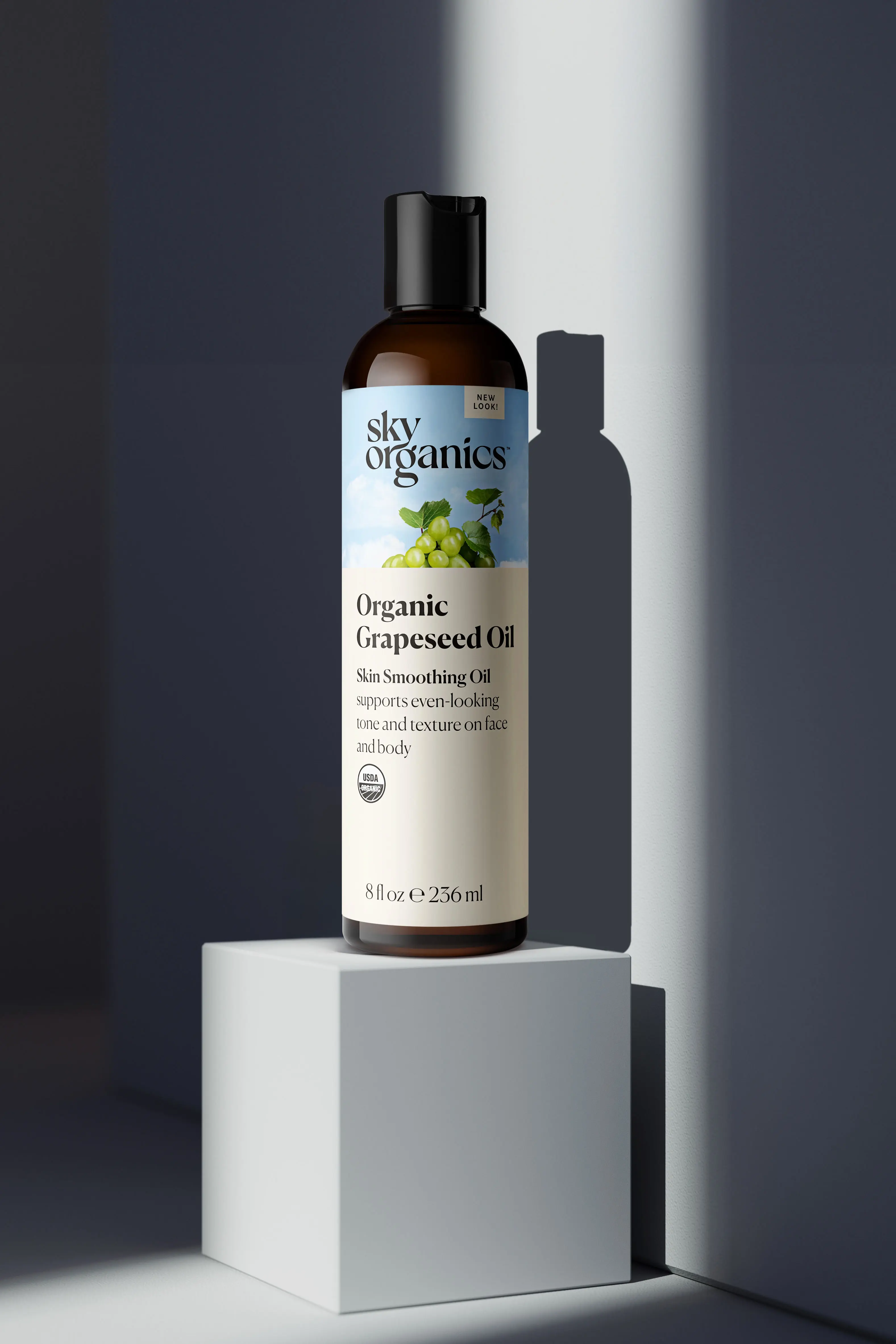 3D product rendering of Sky Organics Grapeseed Oil on pedestal with dramatic shadow and spotlight effect