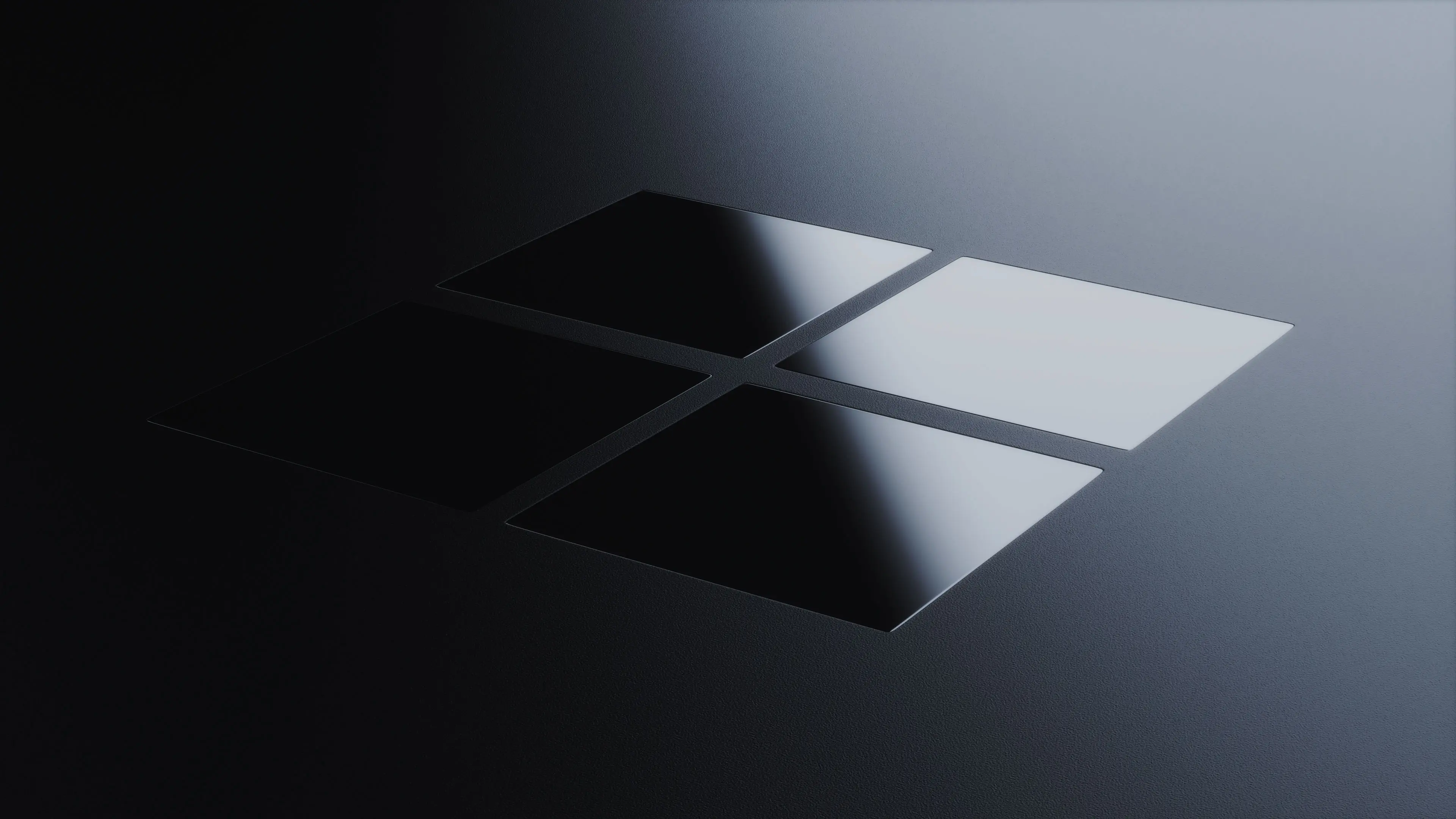 Close-up 3D product render of the Microsoft logo on a dark Surface Pro device, highlighting sleek material and premium finish.