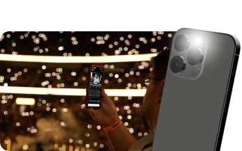 An arena lit by thousands of phones during a light show
