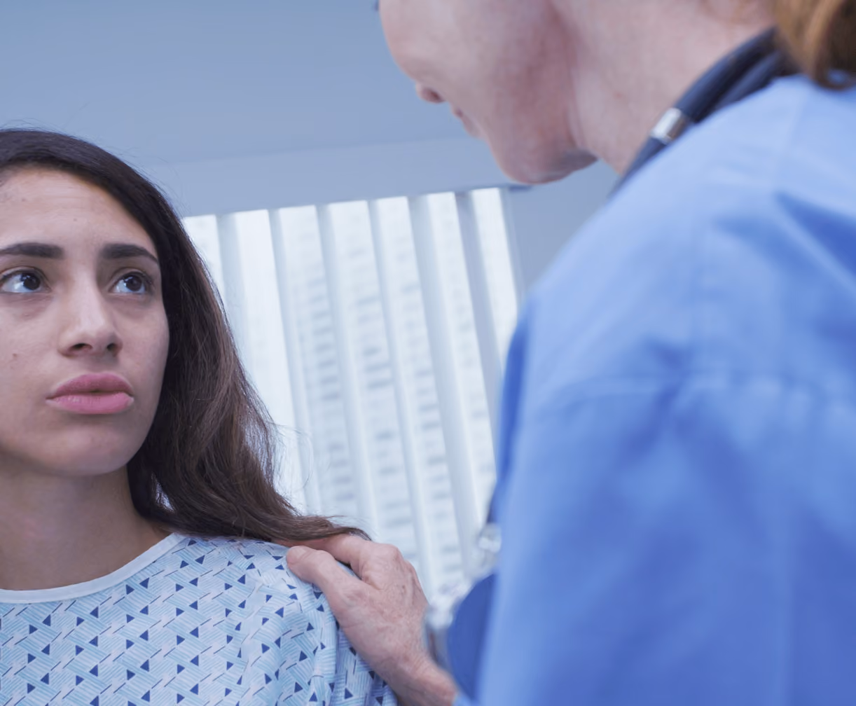 Concerned patient discussing abdominal pain and MALS symptoms with a medical professional during a consultation with the best MALS doctor in Los Angeles.