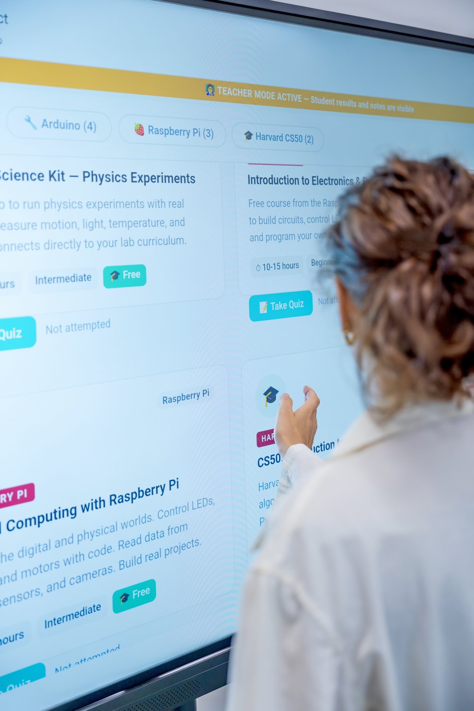 A teacher using the Gali AI tutor on an interactive touchscreen