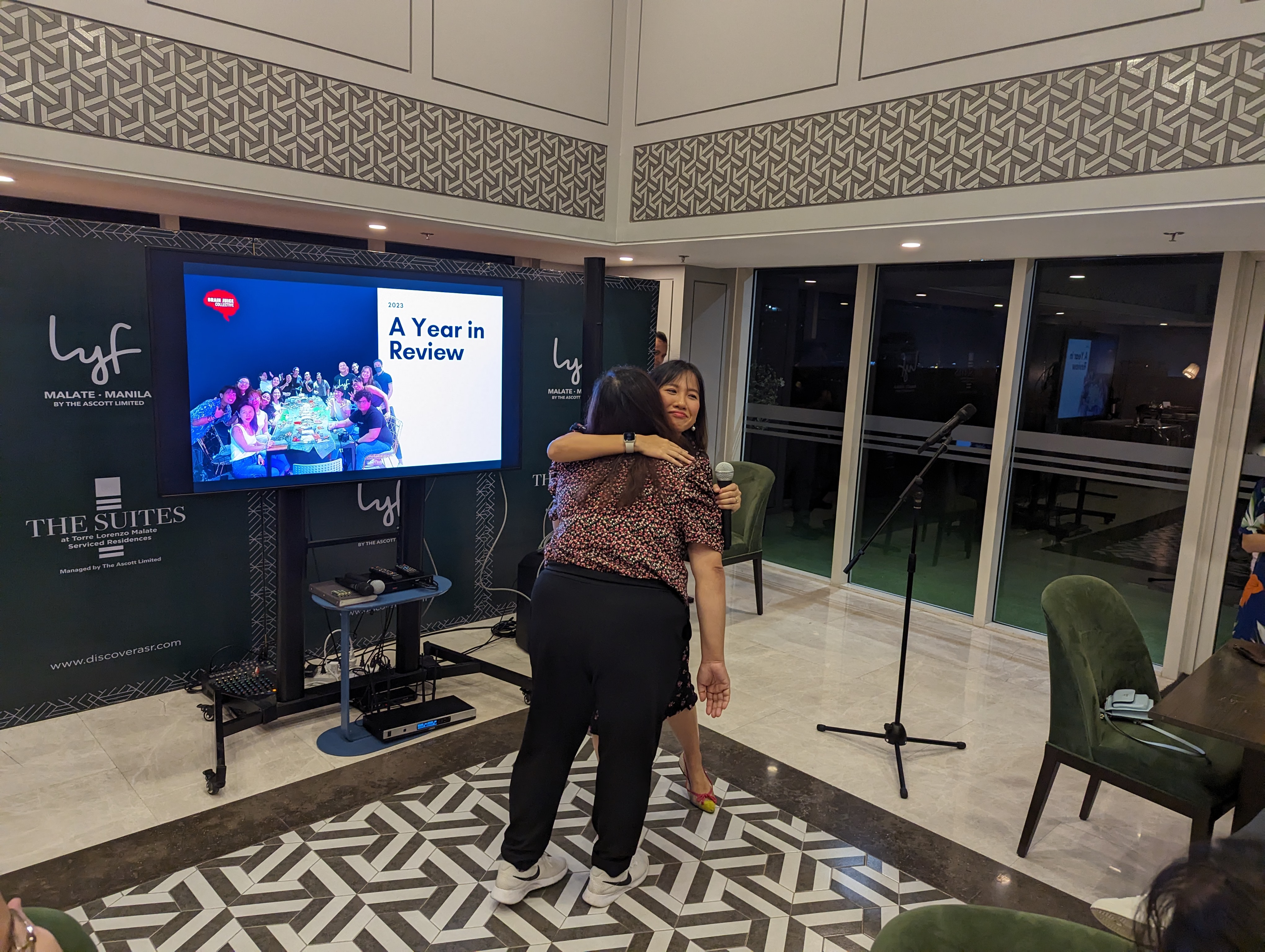 a woman standing in front of a flat screen tv
