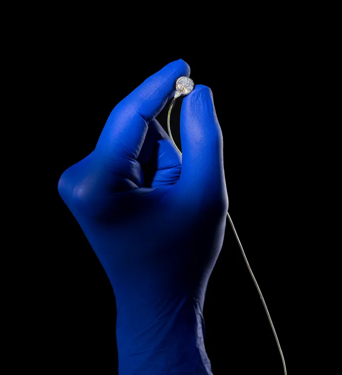 Gloved hand holding module