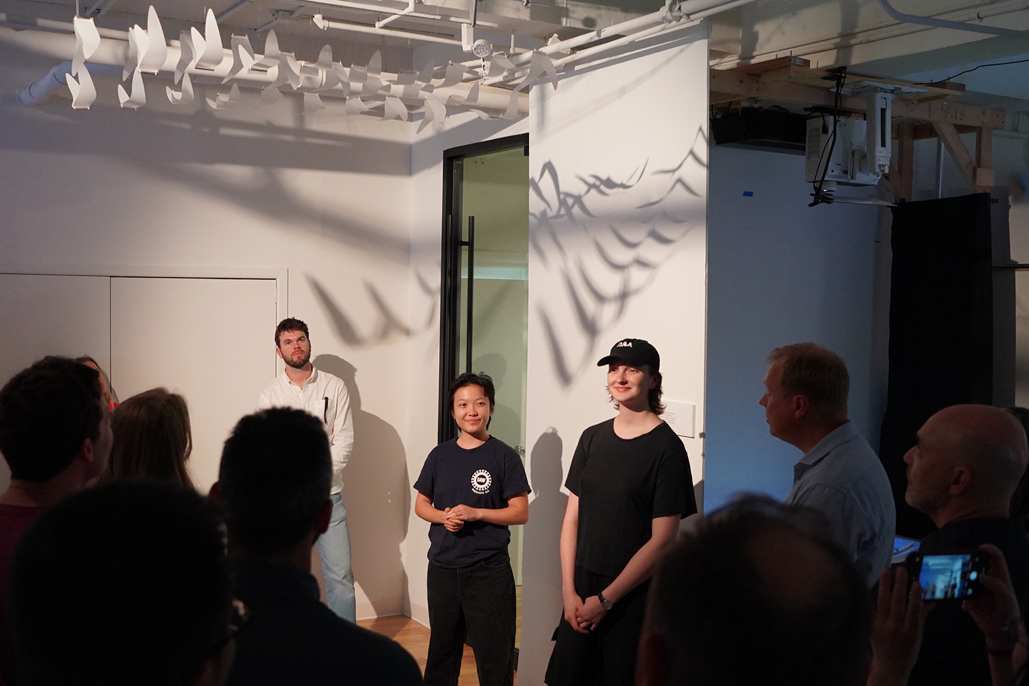 A photograph of Pepi and me standing in front of the sculpture, having a little presentation in front of visitors. 