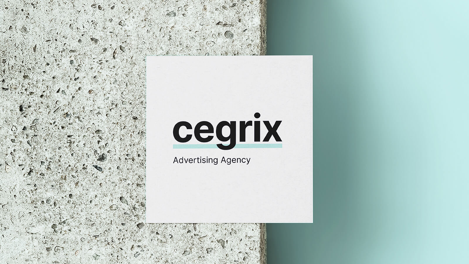 Cegrix Advertising Agency logo displayed on a clean business card mockup placed against a concrete surface and teal background