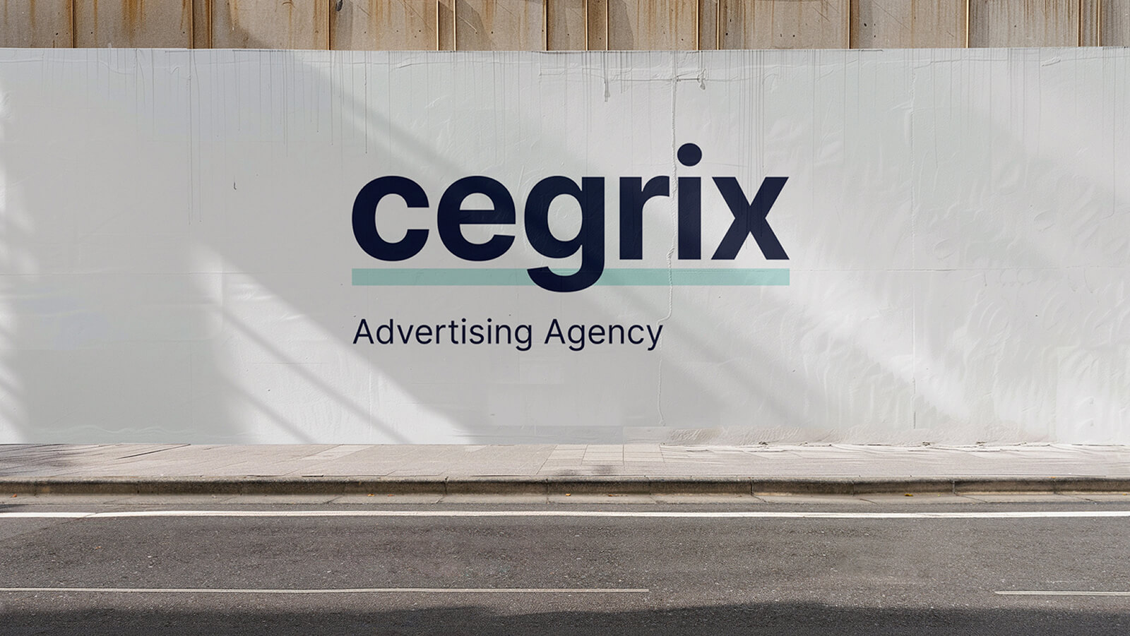 Cegrix Advertising Agency logo displayed on a large outdoor wall sign along a city street.