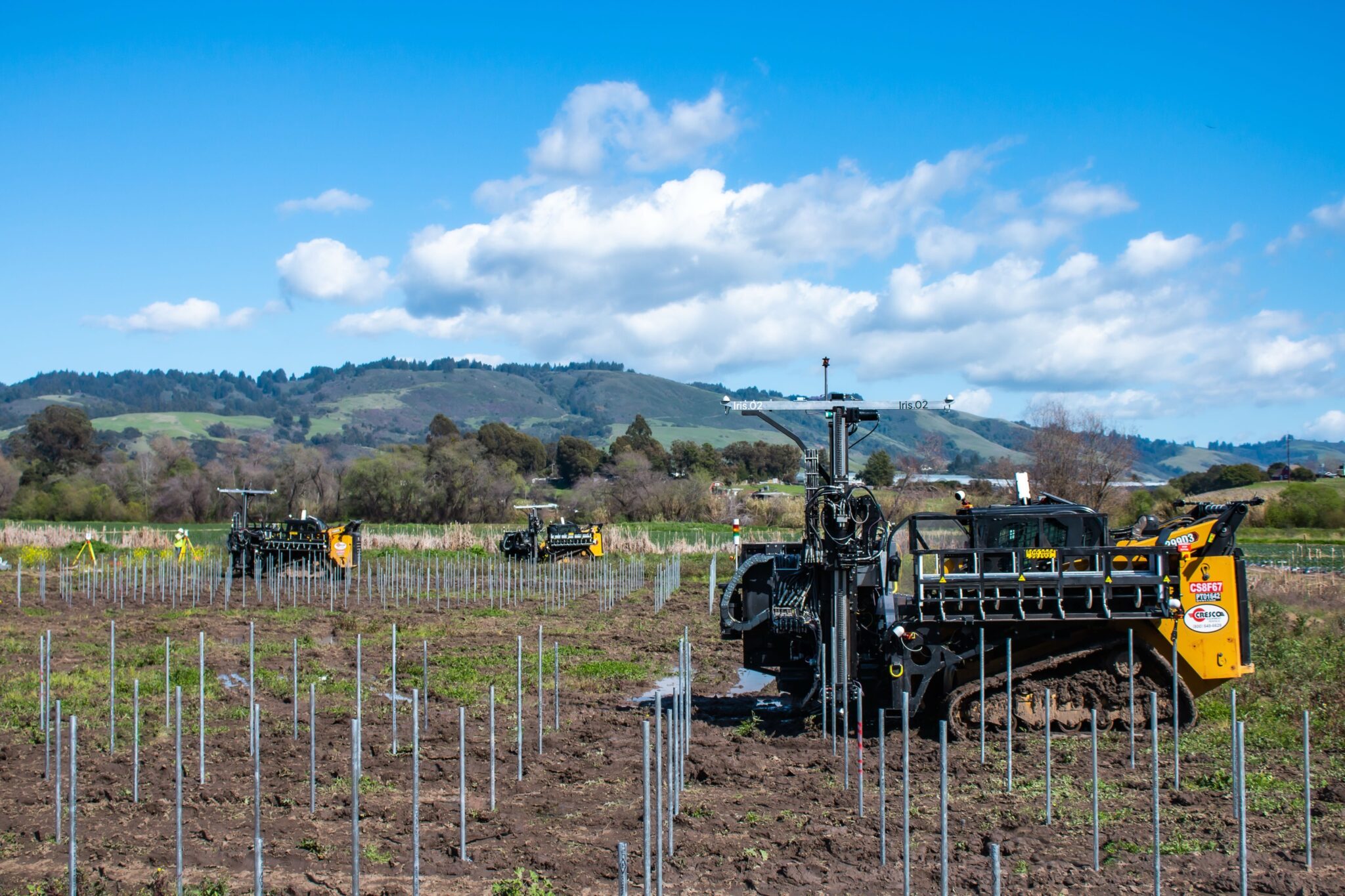Multiple Planted Solar installation robots placing array foundations