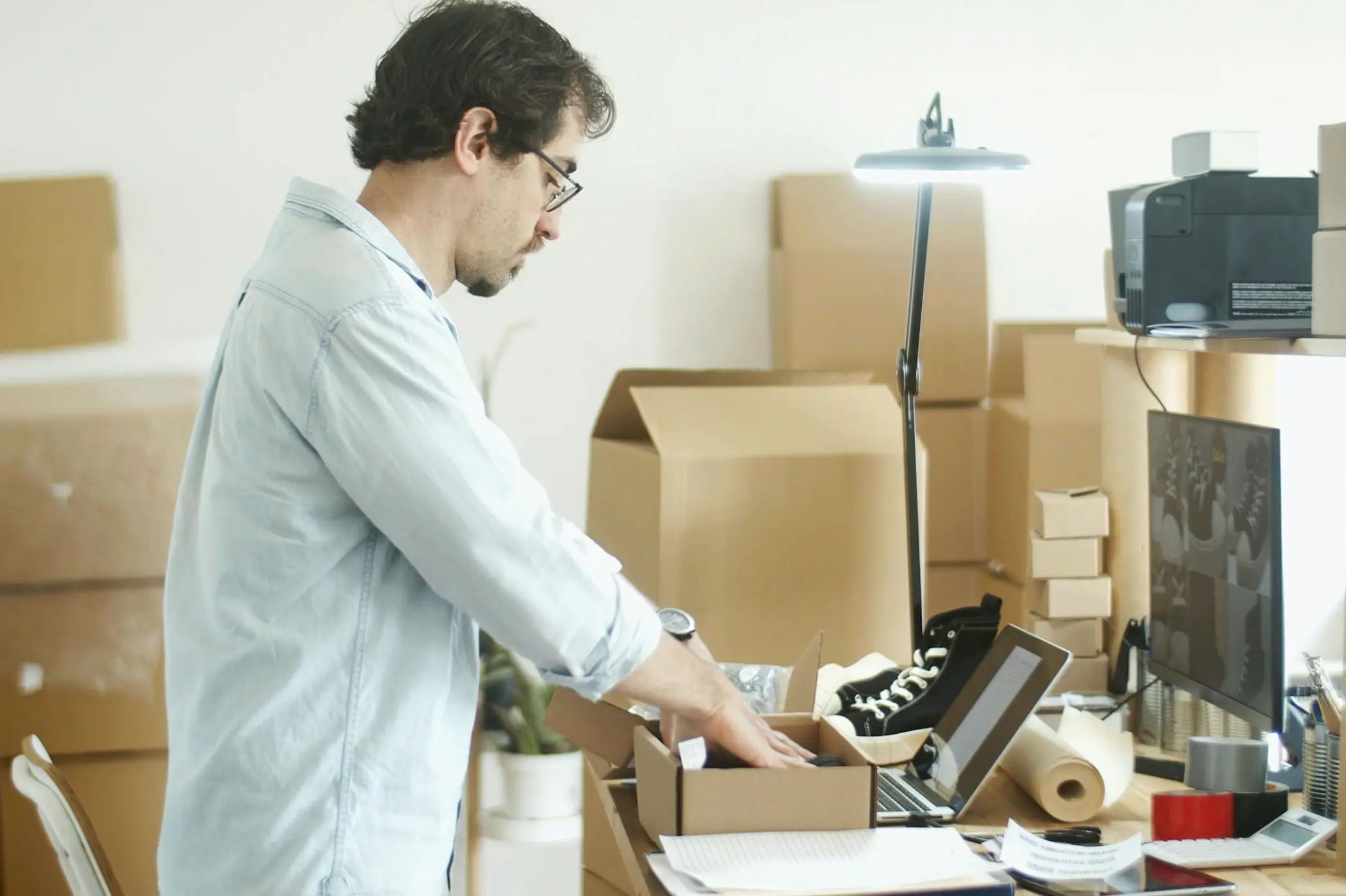 man putting items in the box
