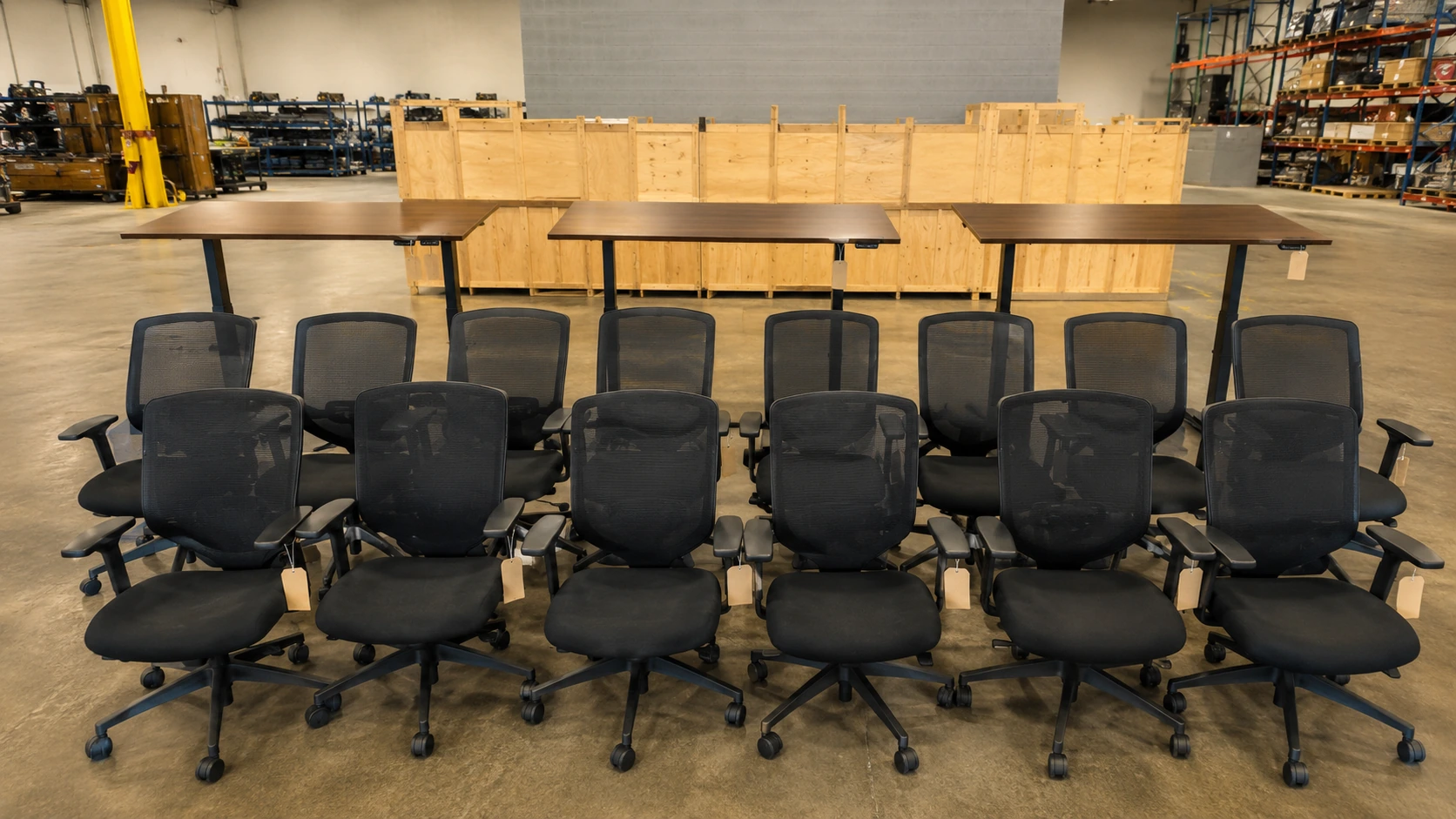 Sorted premium office task chairs and sit-stand desks staged for resale in a Toronto facility supporting sustainable decommissioning and ESG diversion reporting.
