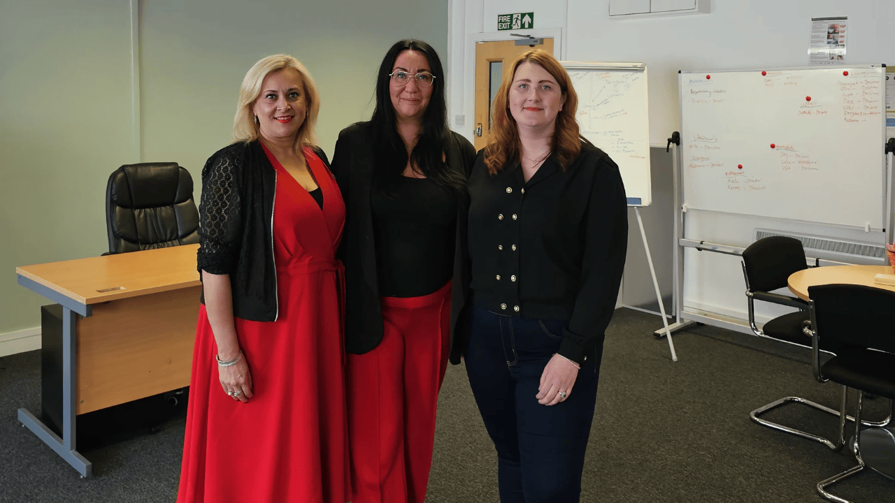 Three members of the Meloosha Homecare team standing together in their office.