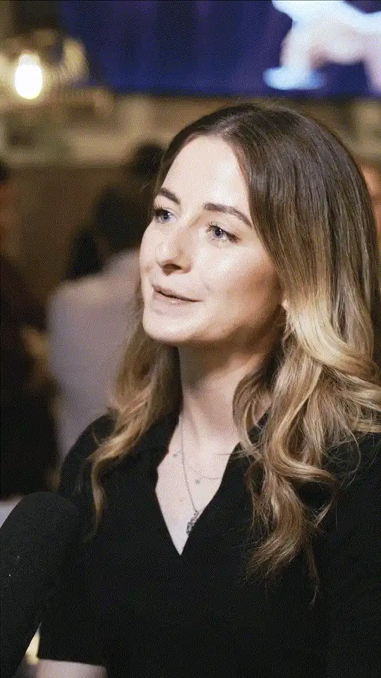 A guest at a business networking evening listening to a question.