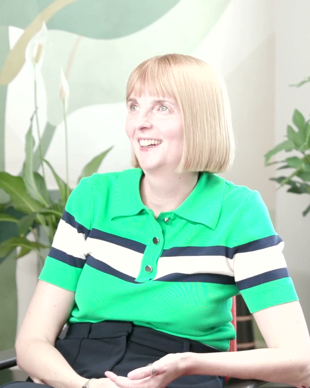Rhi Baxter, co-founder of We Are Brave, smiling as she listens during her interview.