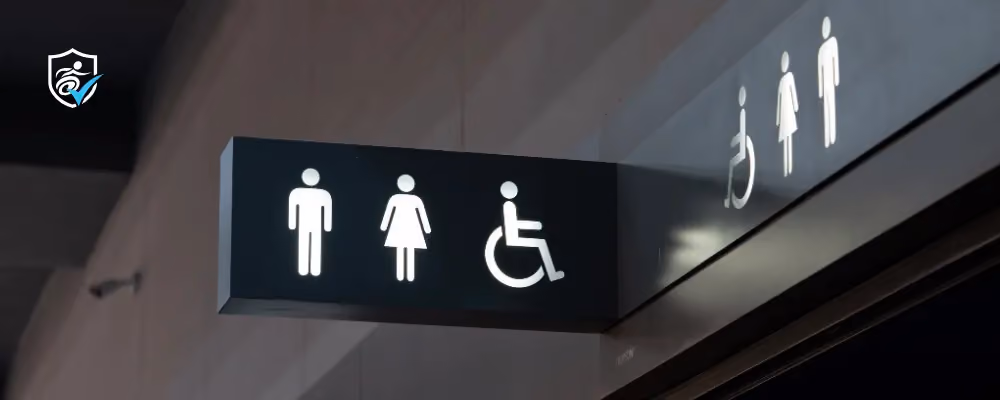 Photo of a sign for a toilet at the airport and a National Disability Card logo.
