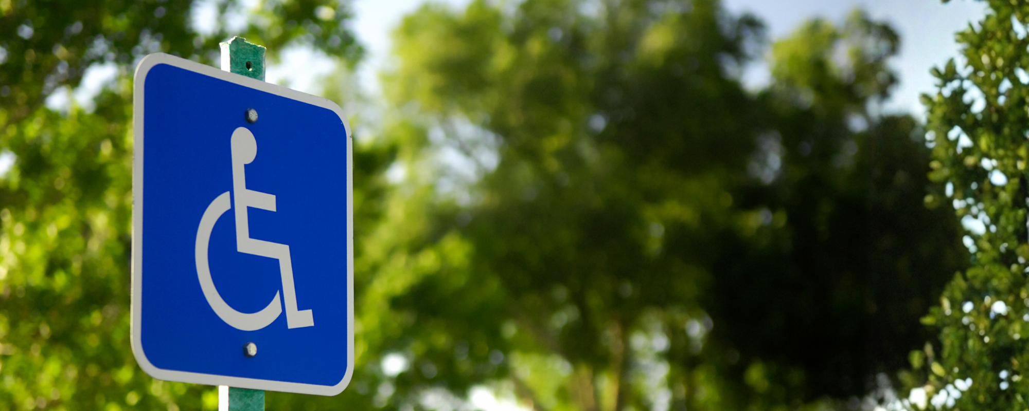 Photo of a sign indicating a disabled parking space.