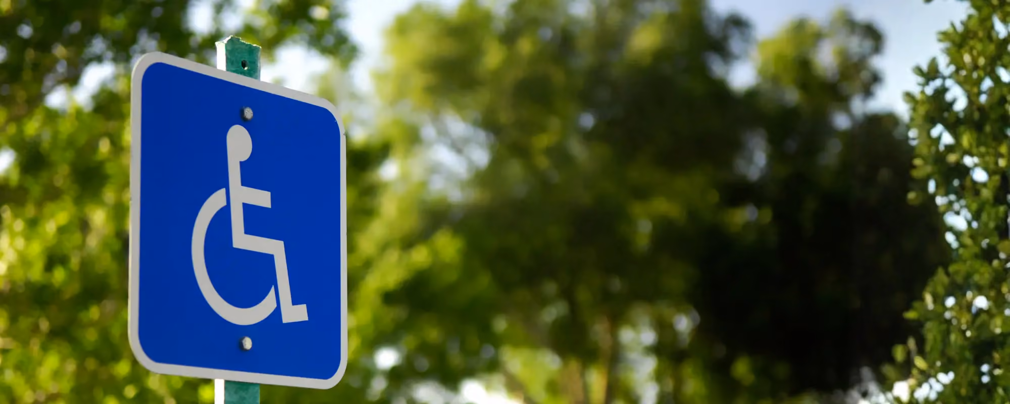 Photo of a sign indicating a disabled parking space.