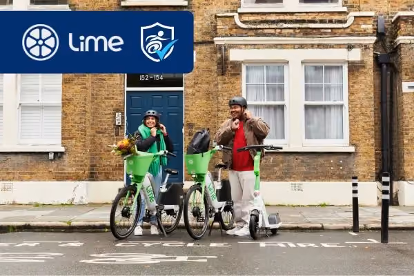 Photo of two people on Lime e-bikes with the Lime and National Disability Card logos