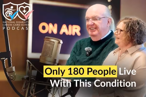 A man and a woman are sitting next to each other. 'On air' is displayed on the wall behind them.