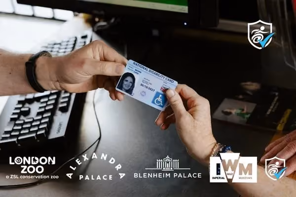 close-up photo of someone handing over their National Disability Card at a ticket kiosk