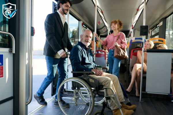 Person helping another person in a wheelchair get onto a bus