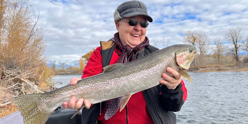 Man holding a steelhead, Fishing trip with Rawhide River Trips, North Fork, ID