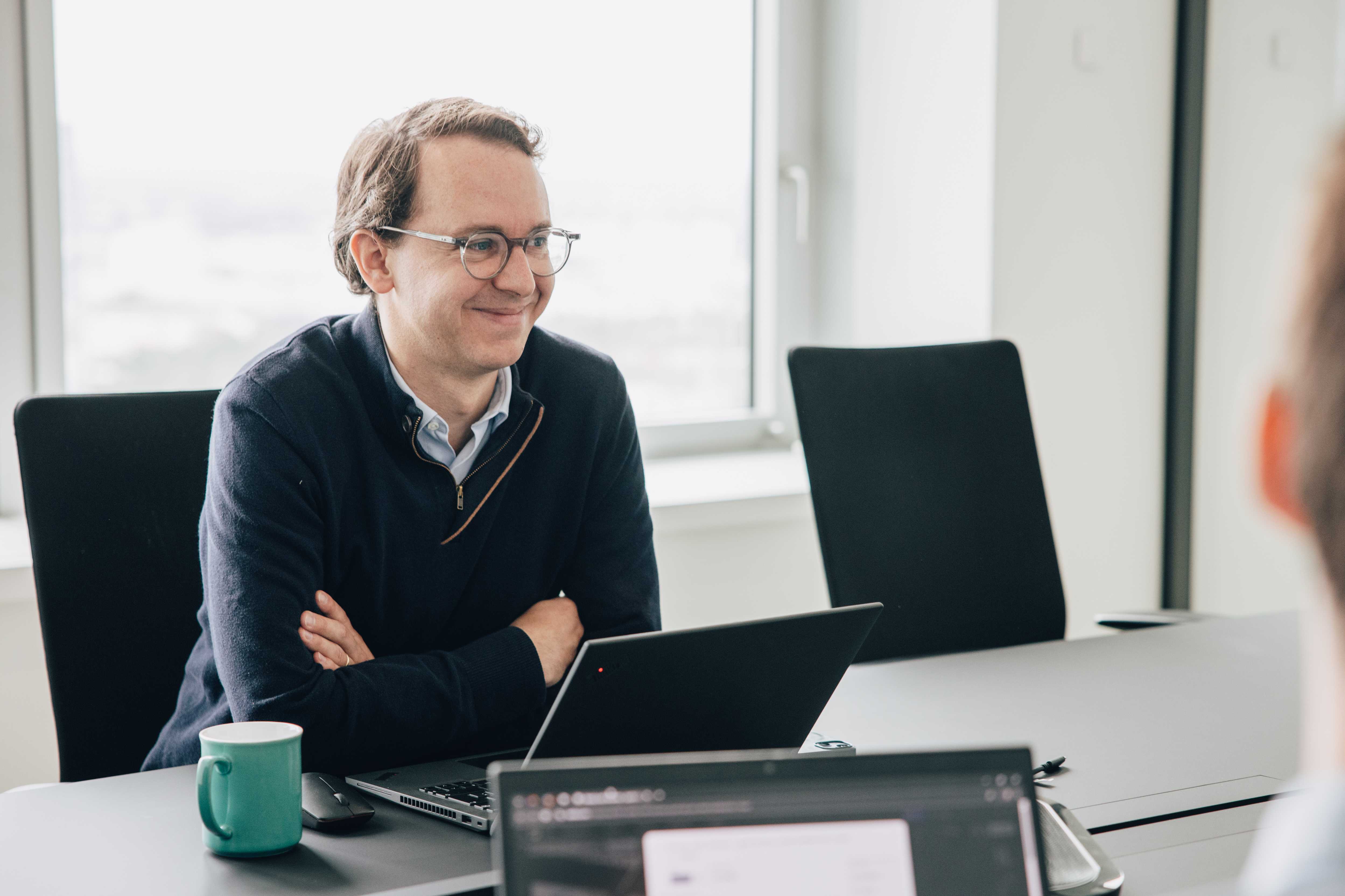 opensee employee in conference room