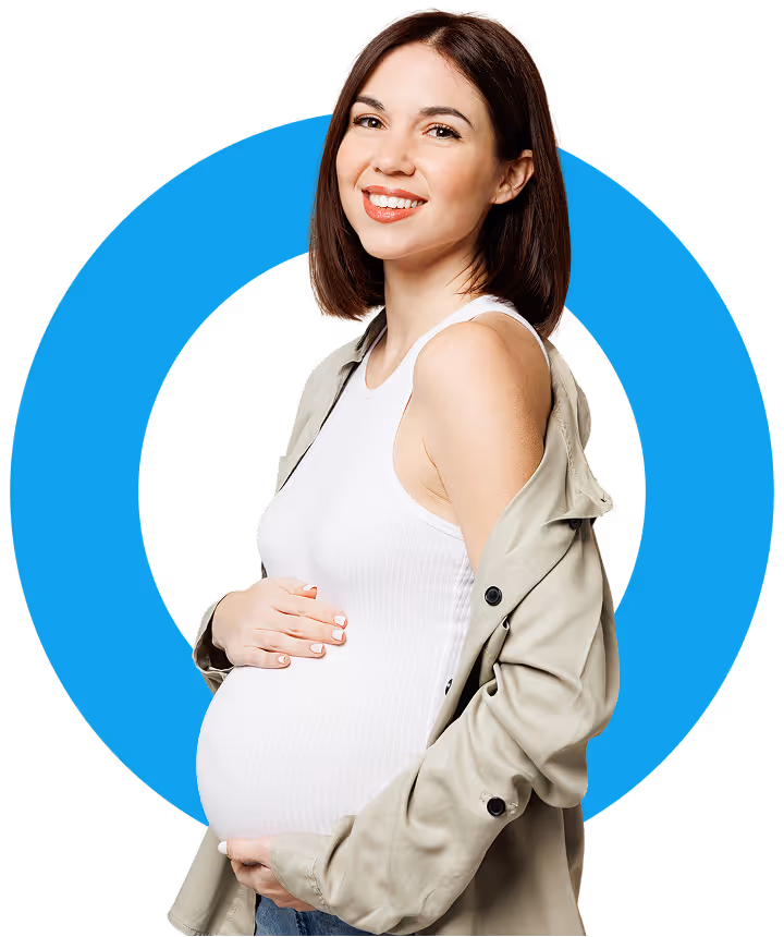 Pregnant woman smiling with her hands around her stomach