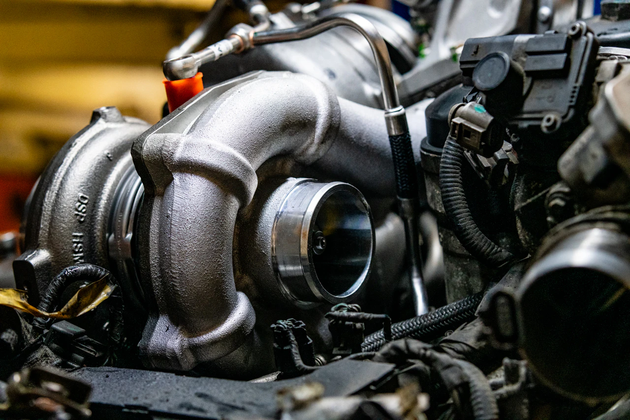 a turbocharger in a truck engine waiting for repair